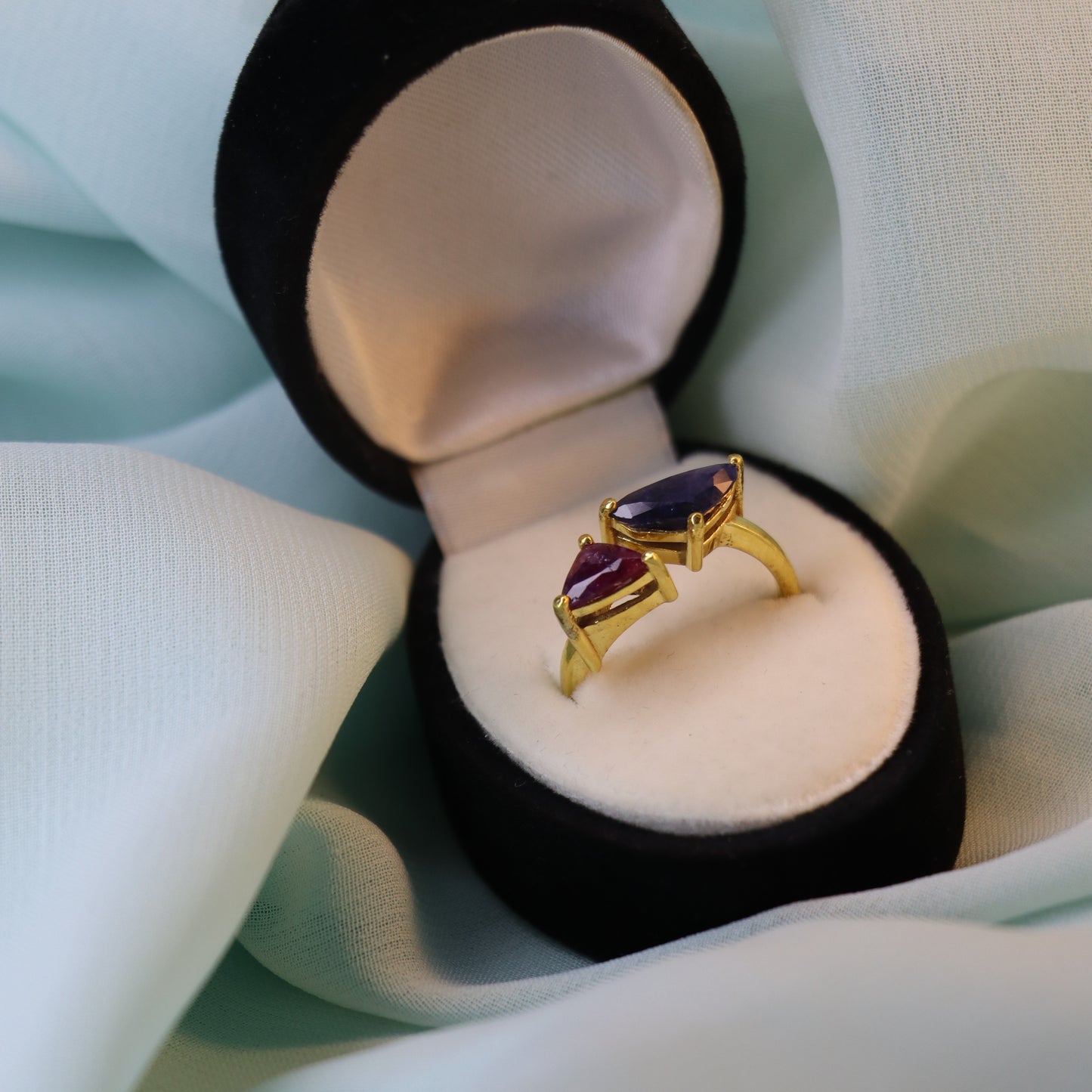 Royal Convergence – Blue Sapphire and Garnet Triangle-Shaped Gold Ring | Sovereign Splendor Forbidden Collection