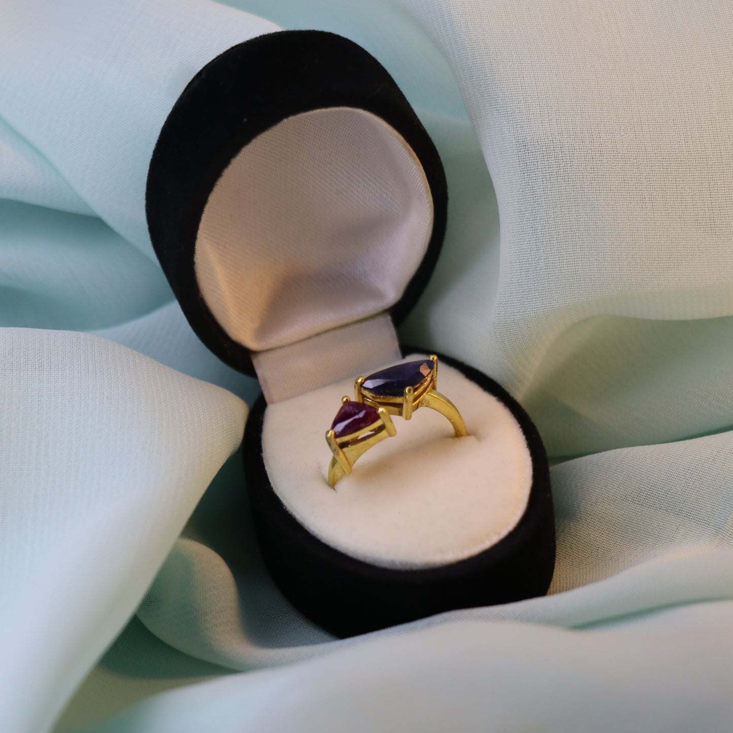 Royal Convergence – Blue Sapphire and Garnet Triangle-Shaped Gold Ring | Sovereign Splendor Forbidden Collection