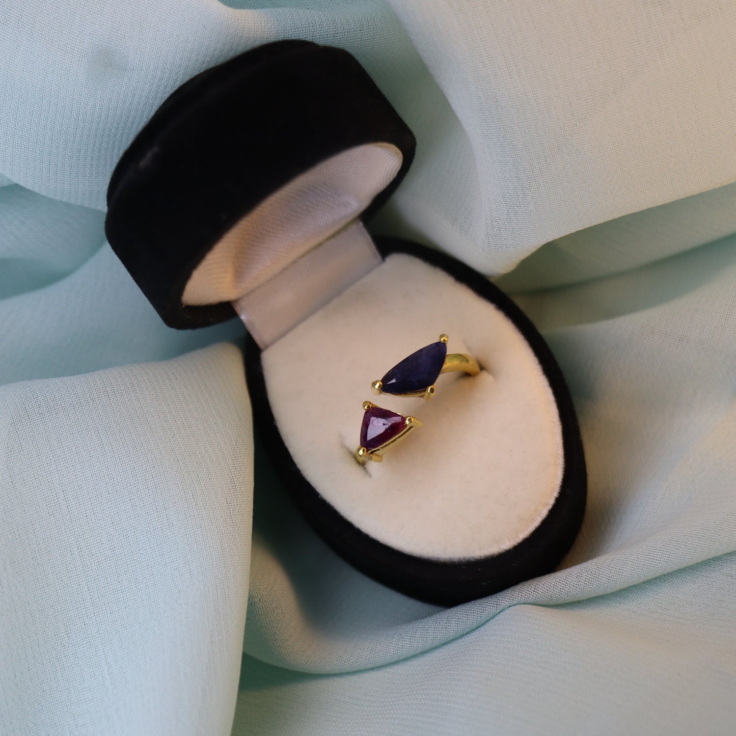 Royal Convergence – Blue Sapphire and Garnet Triangle-Shaped Gold Ring | Sovereign Splendor Forbidden Collection